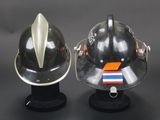 two helmets that are sitting on top of each other