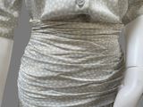 a mannequin wearing a dress on a mannequin mannequin