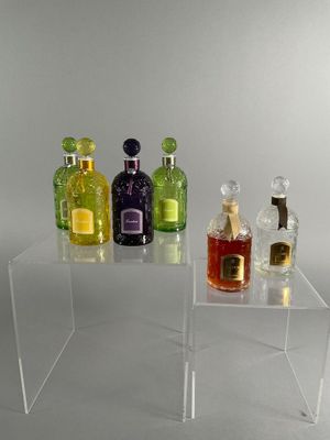 a clear table with bottles of liquor on it