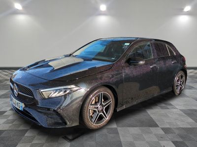 the mercedes cla is parked on a checkered floor in a garage