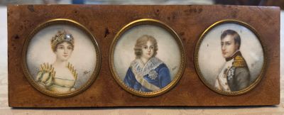 three miniature portraits of a man and a woman are on display