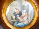 painting of a man and a woman sitting at a table with a pitcher
