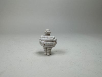 a small statue of a man made out of metal