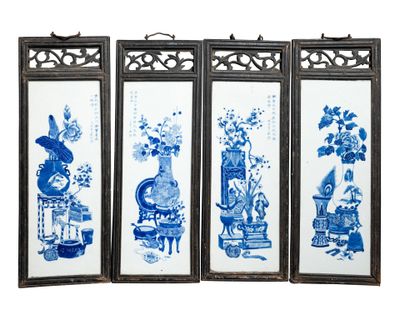 three framed blue and white pictures of vases and flowers