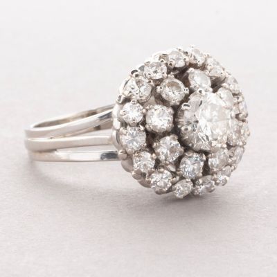 an image of a diamond cluster ring on a white background
