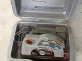 an open box with a vacuum in it on the floor
