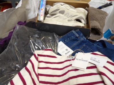a box full of clothes and a pair of shoes