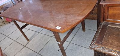 a wooden table with a bowl of fruit on top of it