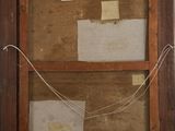 an old picture frame with a piece of paper taped to it