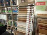 a book shelf with many books on it in a store