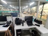 an image of a room with a bunch of computers on the desk