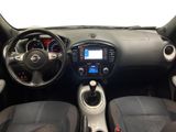 the interior of a small car with a dashboard and steering controls