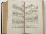 an open book that is sitting on a table