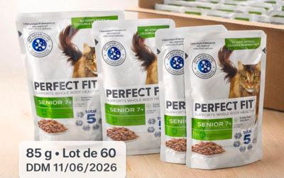 three bags of perfect fit cat food sitting on a table