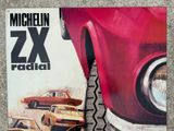 a picture of a magazine with a picture of a red car