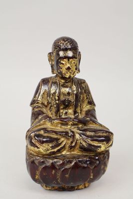 an image of a statue of a buddha sitting in a lotus position