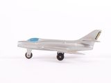 a toy airplane that is sitting on a white surface