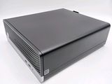 an image of a small black computer on a white surface
