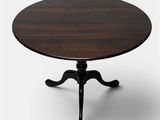 an image of a round table with a wooden top and black legs