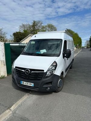the white van is parked on the side of the road