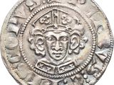 a close up of a coin with a crown on top of it