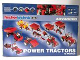 a box with a bunch of toy tractors in it