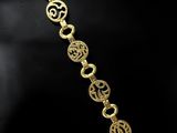 a close up of a gold bracelet on a mannequin mannequin mannequin mannequin mannequin mannequin mannequin manne