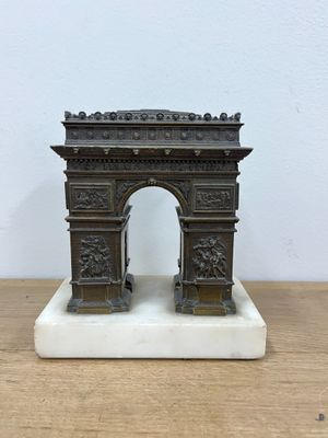 an image of a statue of a gate on a wooden table
