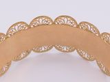an image of a close up of a gold plated headband