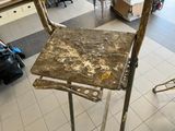 a dirty chair sitting in the middle of a room