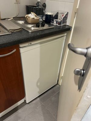 a kitchen with a sink, dishwasher, and dishwasher in it