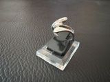 a cell phone that is sitting on top of a glass stand