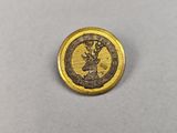 a close up of a gold coin with a deer on it