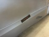 a close up of a car door with a sticker on it