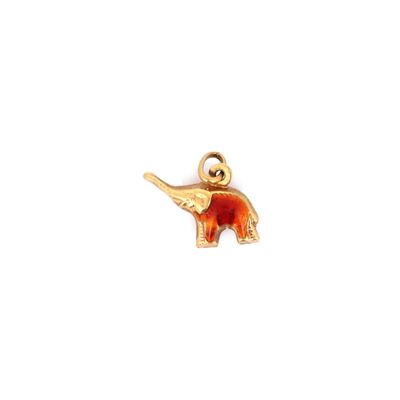 une image représentant un pendentif en forme d'éléphant en or, orné d'un éléphant rouge et blanc