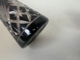 a black and white vase sitting on a table