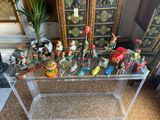 a glass table with a bunch of figurines on it