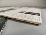 two books sitting on top of a table next to each other