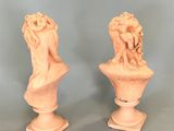 pair of carved marble busts of a woman and a man