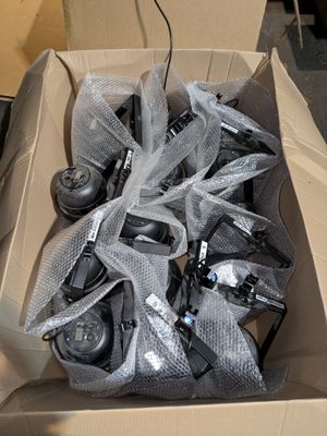 a cardboard box with a bunch of cell phones inside of it