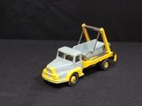 a toy truck with a crane on the back of it