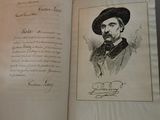 an old book with a drawing of a man in a hat