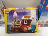 a box with a toy train with ice cream on it