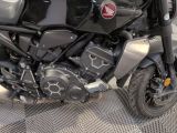 a motorcycle that is parked on the side of the street