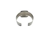 a close up of a silver ring on a white background