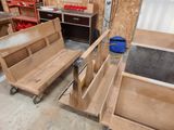 a wooden bench and a bench on wheels in a room