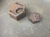 two nuts sitting on top of a metal pan