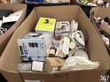 a cardboard box filled with many different types of items