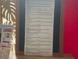 a table with a menu and a pair of scissors on it