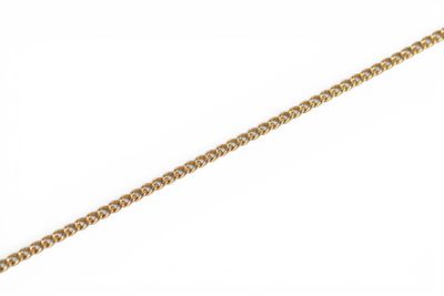 a close up of a gold chain on a white background